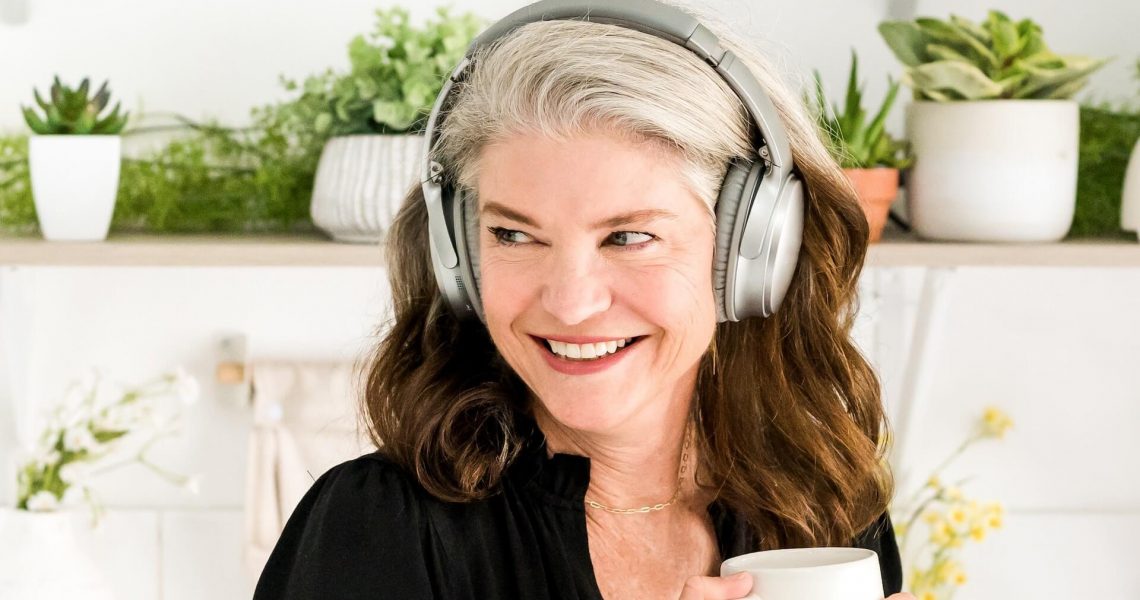 A lady listening to music and smiling